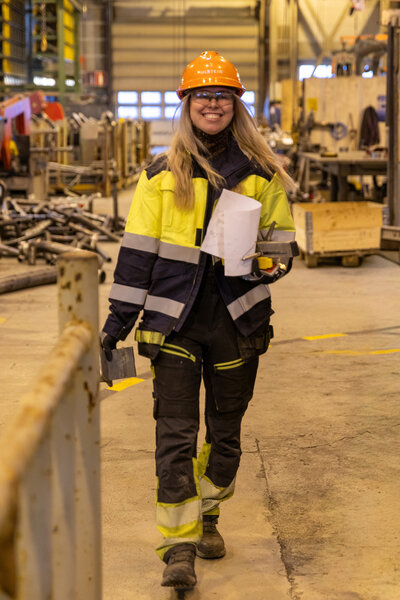 Industrial worker in pipe hall upload