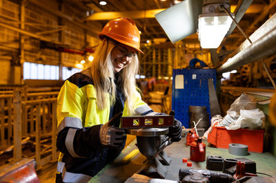 Industrial worker measuring a pipe upload1