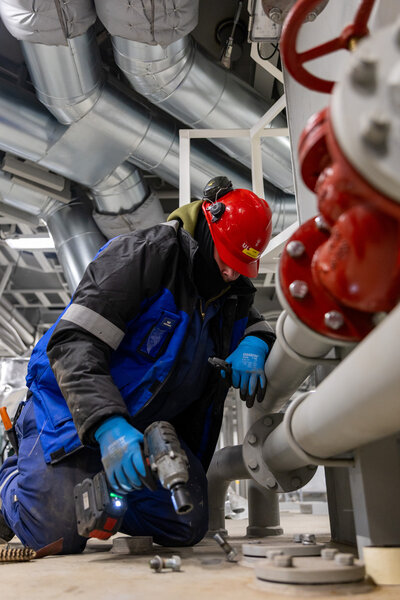 Industrial worker working with pipes upload