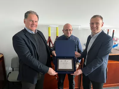 Olympic's Runar Stave and Rune Grande together with CRIST representative, Jakub Sobotko.