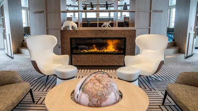 Cozy seating in front of the fireplace on the NatGeo Endurance.