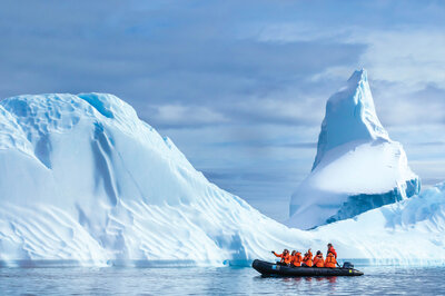 Zodiac and iceberg, courtesy of Lindblad Expeditions.