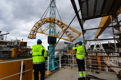 The first loading arm being positioned in March 2021.