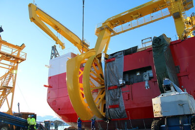 People appear small next to the dimensions of the equipment being installed on the Nexans Aurora.