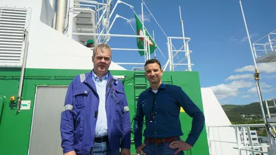 Change of flags, from left Ulstein Verft project manager Helge Torvik and site manager for Bernhard Schulte, Markus Hübner.