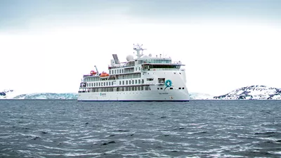 Greg Mortimer in icy waters, photo courtesy of Aurora Expeditions.