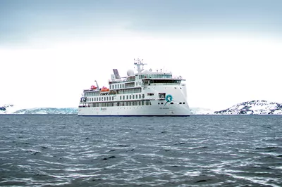 Greg Mortimer in icy waters, photo courtesy of Aurora Expeditions.