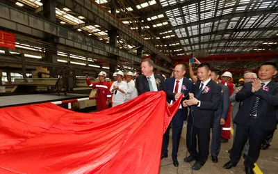 Commercial director in Ulstein Design & Solutions, Lars Ståle Skoge (left), at the steel cutting ceremony on the Ocean Explorer.
