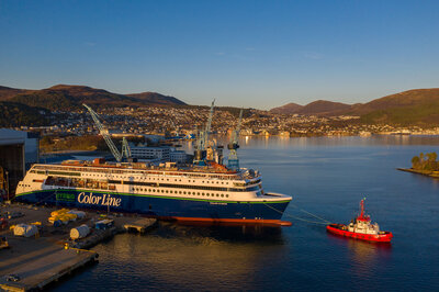 The evening sun settling over the 'Color Hybrid' during her launch from the dock hall at Ulstein Verft. (Photo: Oclin / Hallstein Mala)
