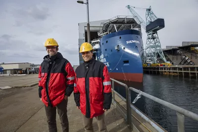 Andres Chacon, Technical Project Manager, and Matthias Müller, Managing Director in Bernhard Schulte Offshore GmbH at the launch of their first SOV at Ulstein Verft, the Windea La Cour.