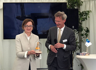 The Lady Sponsor with the remains of the Champagne bottle.