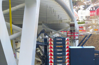 The dissambled crane on the barge passing underneath the new Loftesnes bridge.