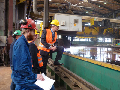 Steel cutting marks the production start of a shipbuilding project, here closely watched by Ulstein Verft and Color Line representatives.