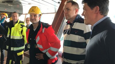 Representatives from BS Offshore explaining the benefits of their service operation vessels for offshore wind farm service.