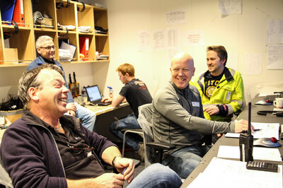 Enthusiastic employees in the control room.