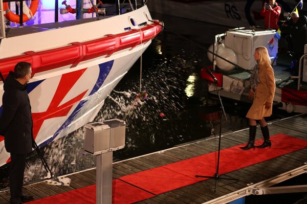 The bottle broke at the second go - Lady Sponsor Gunvor Ulstein in action.